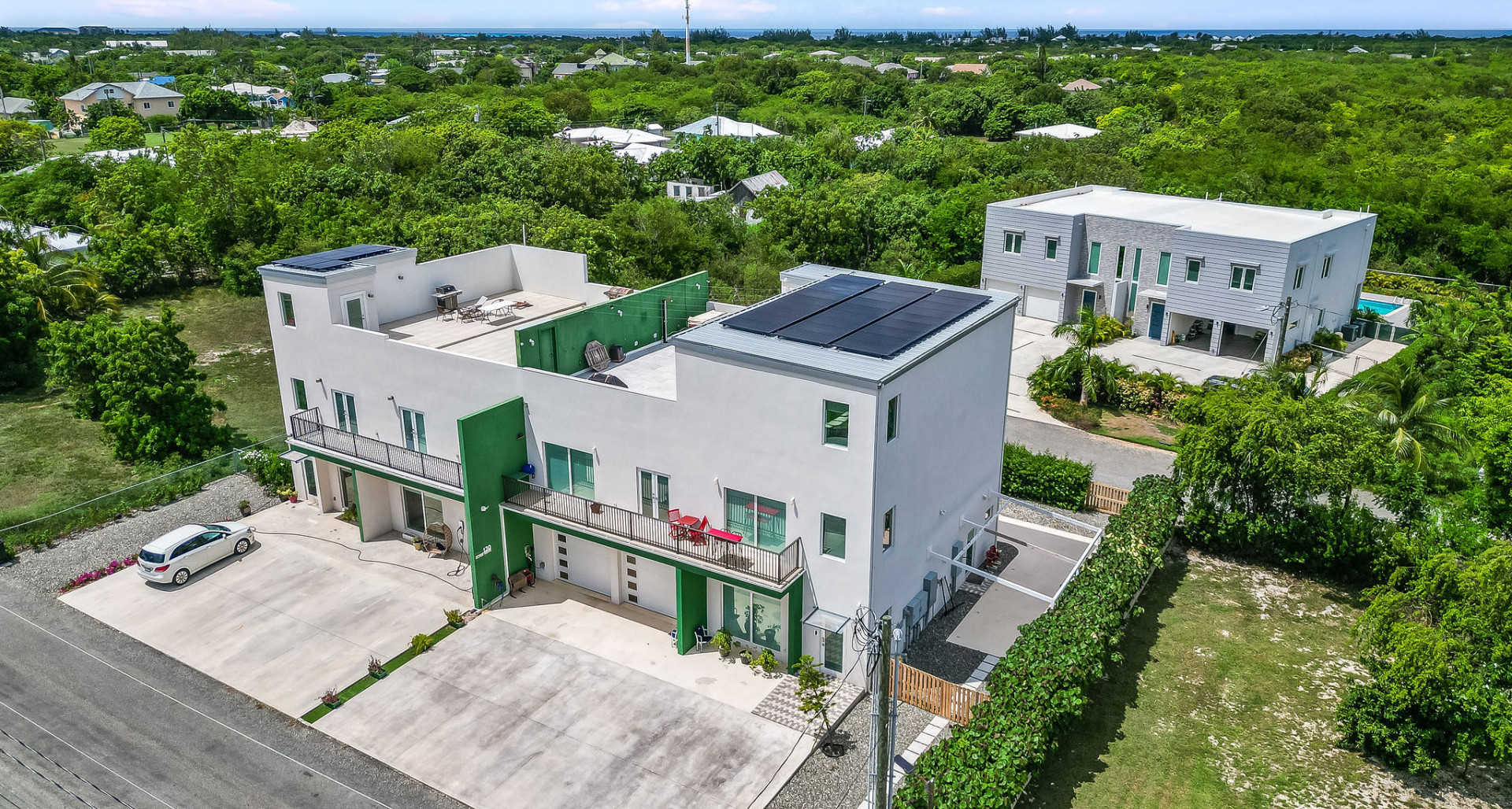 3-Story Duplex with 8-Car Garage & Rooftop Oasis image 1