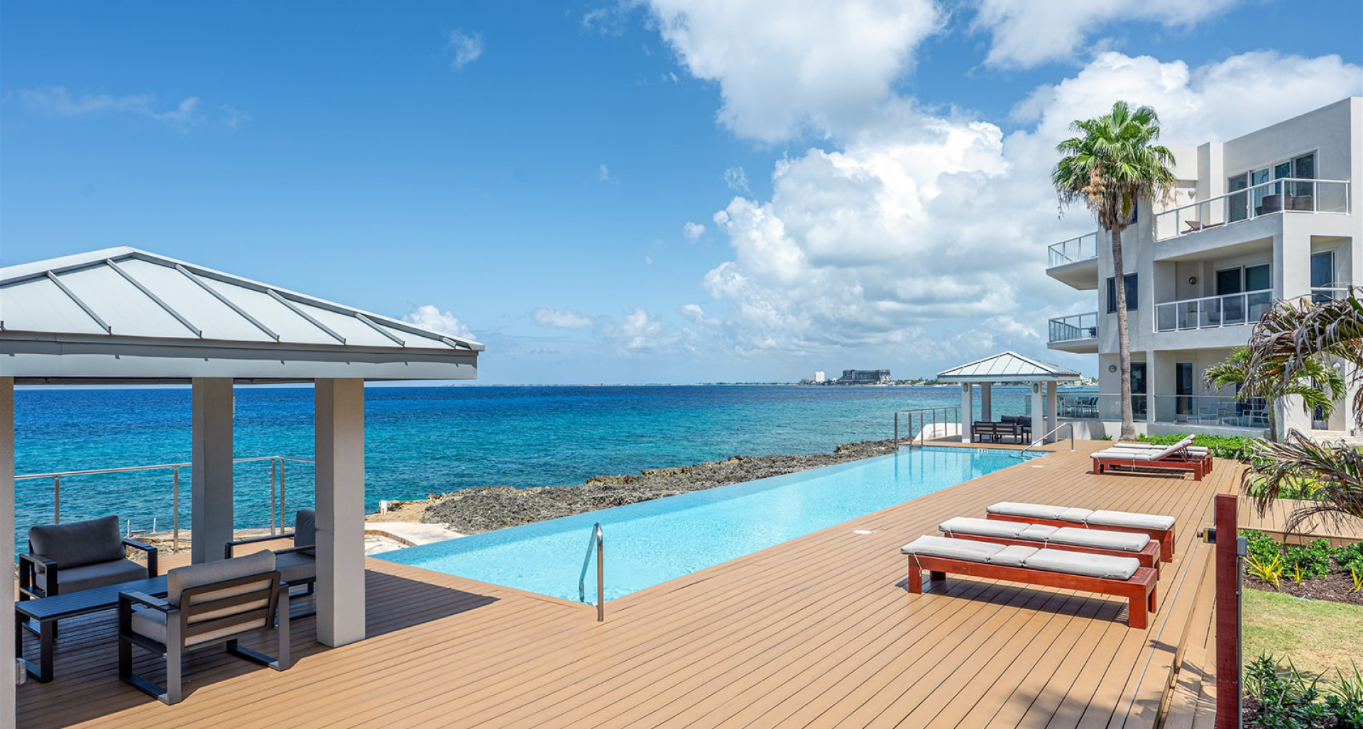 Elevated Elegance: Three-Level Oceanfront Penthouse image 3